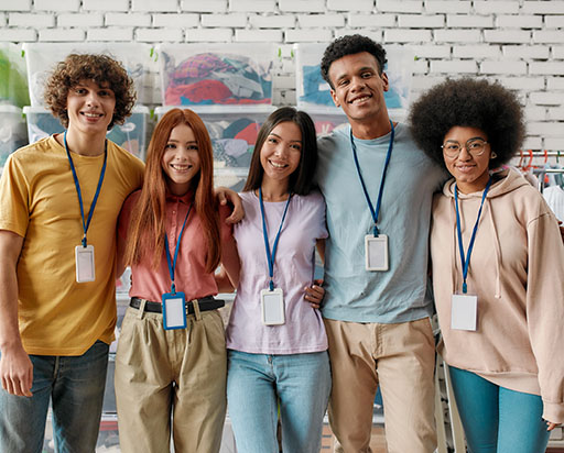 Five high school students standing together smiling