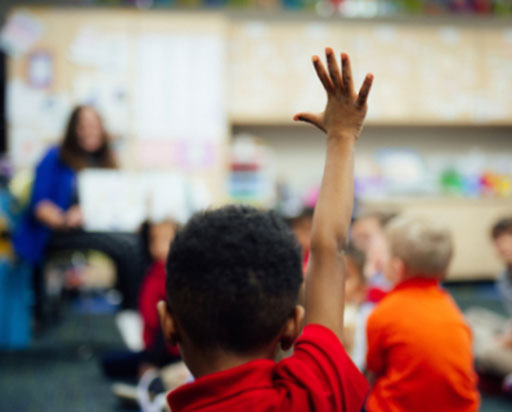 Child raising hand.