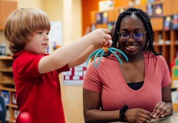 Teacher working with preschool student