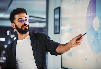 Man pointing at chart in presentation