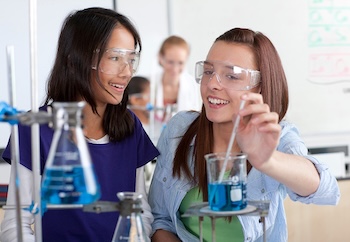 Two girls working in a science lab