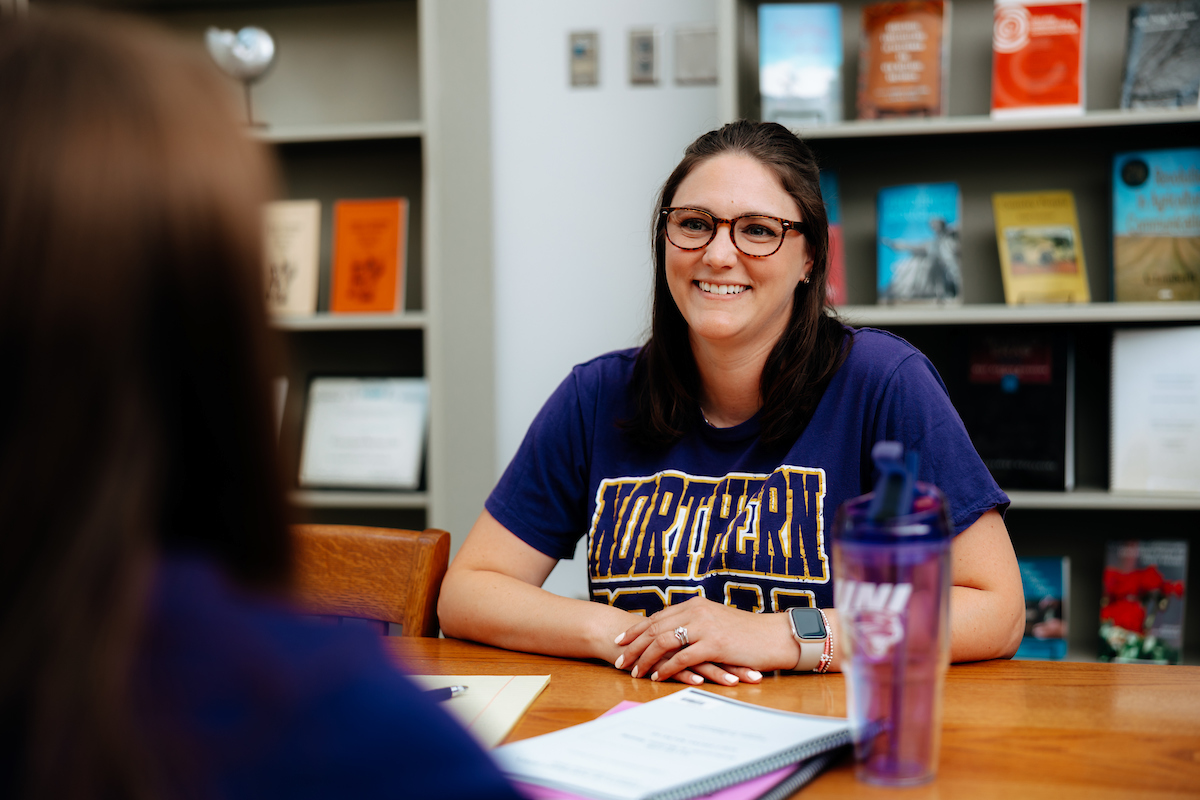 UNI staff working with student