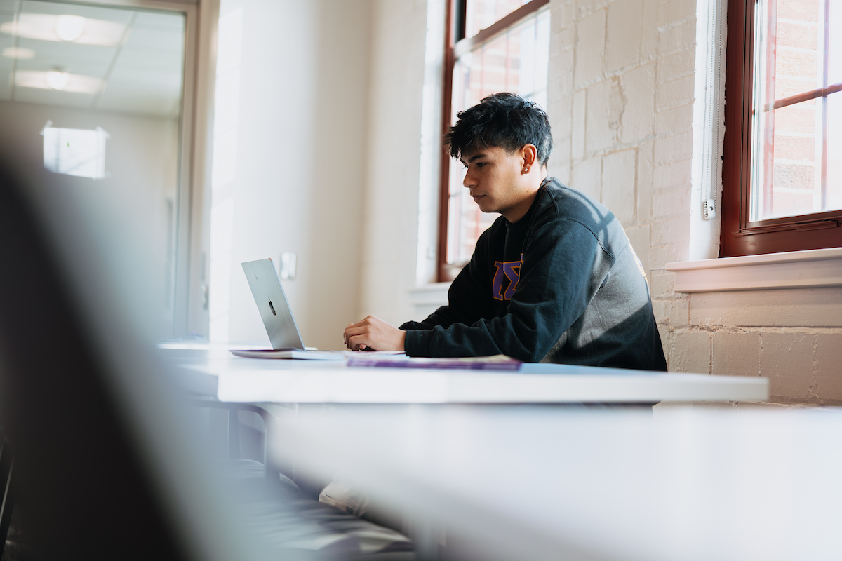 student on his laptop