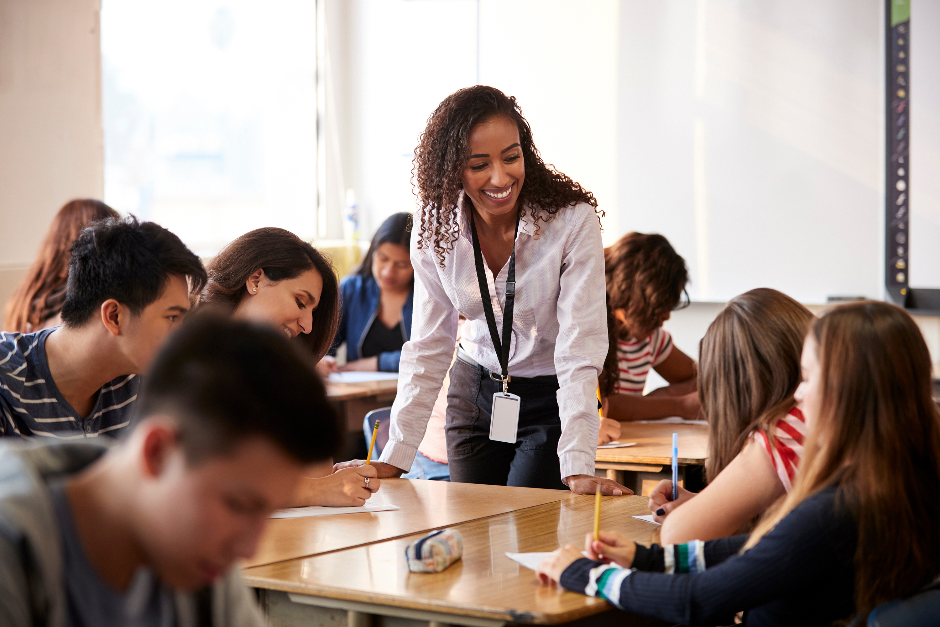 Female teacher working with students