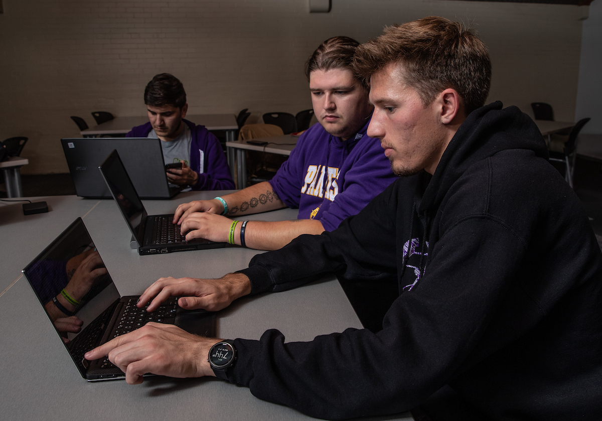 Students working on laptops.