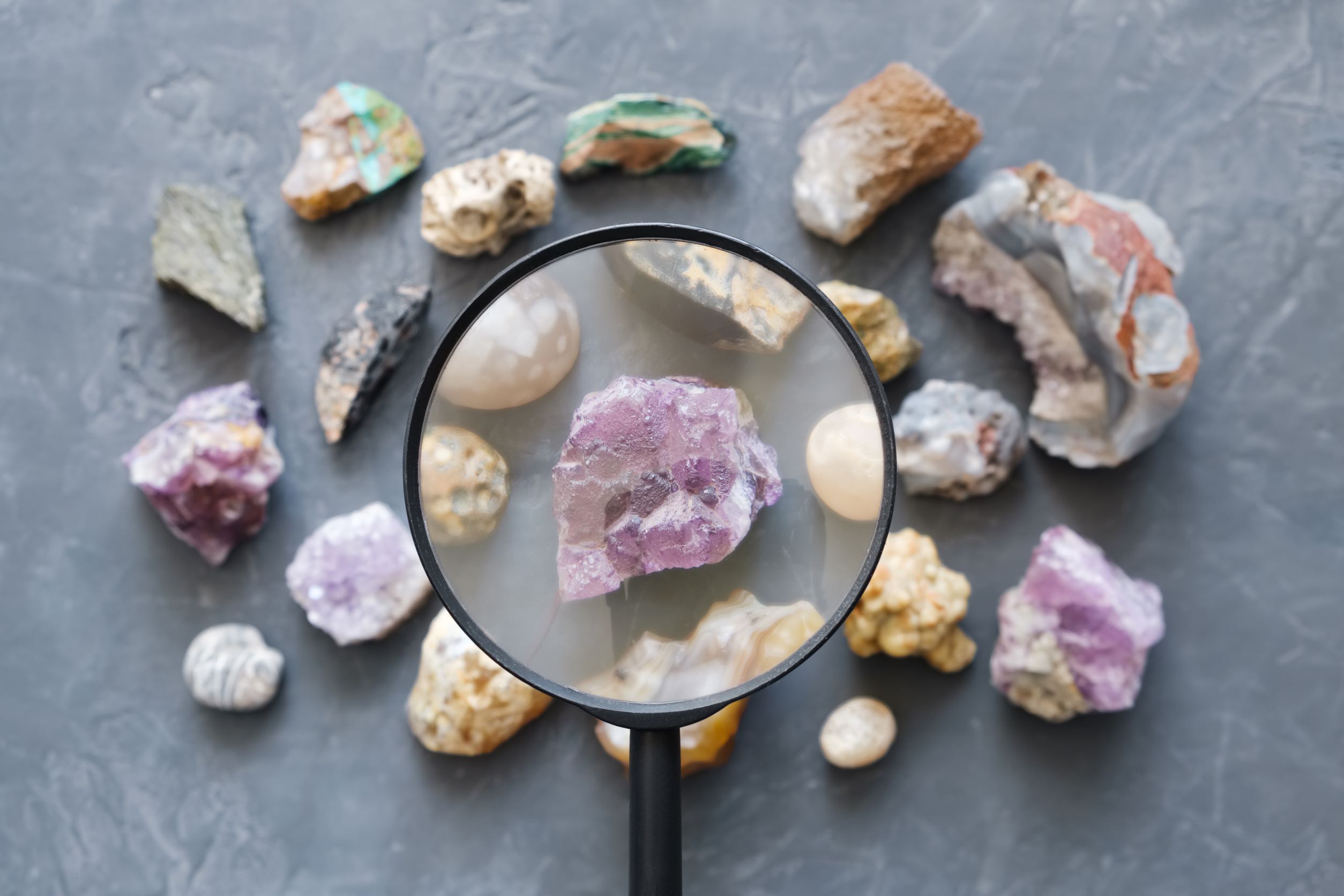 a magnifying glass over a group of rocks