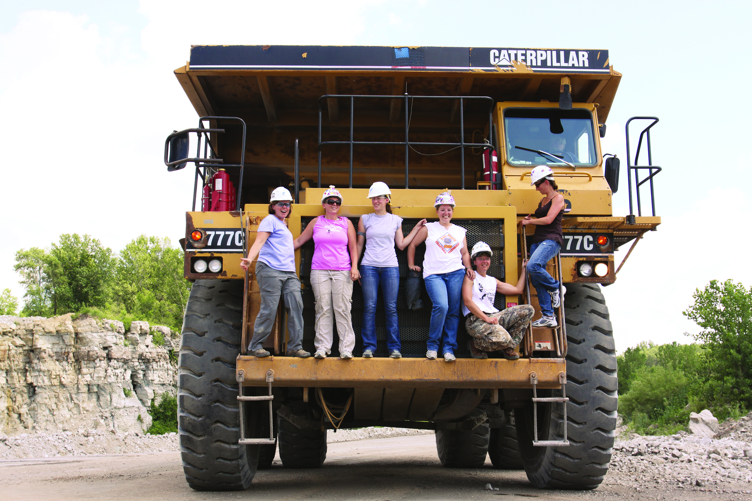 students standing on a big truck