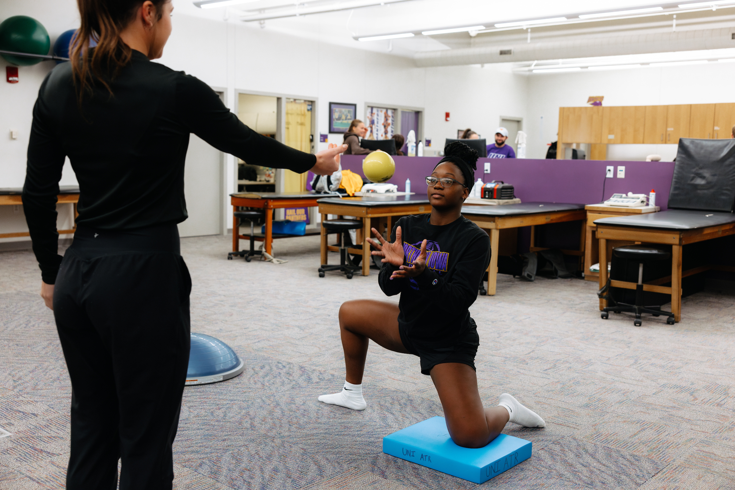 Instructor working with athlete.