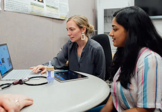 Health professional working with a female client