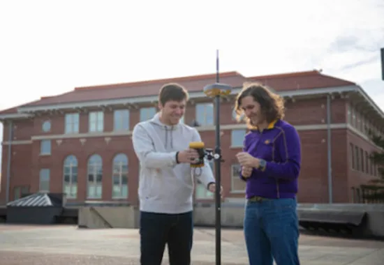 Students working on project outside.