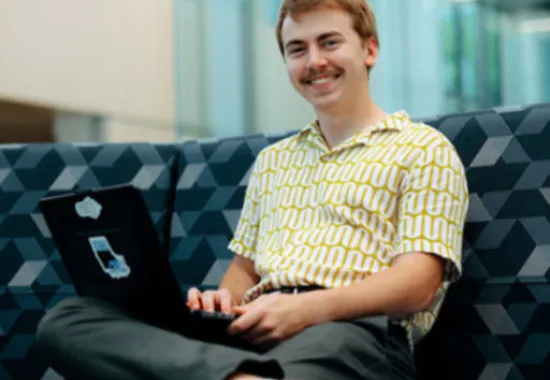 Student working on computer.