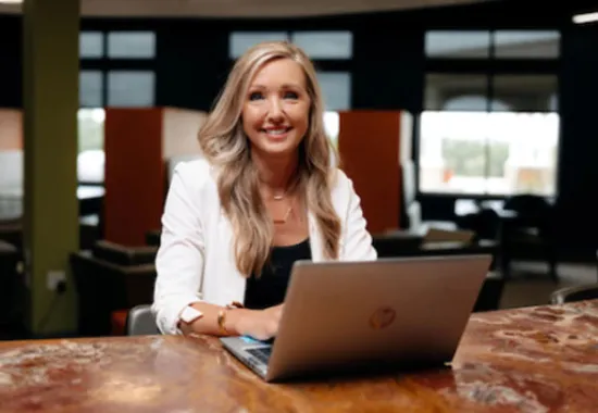 Student working on laptop.