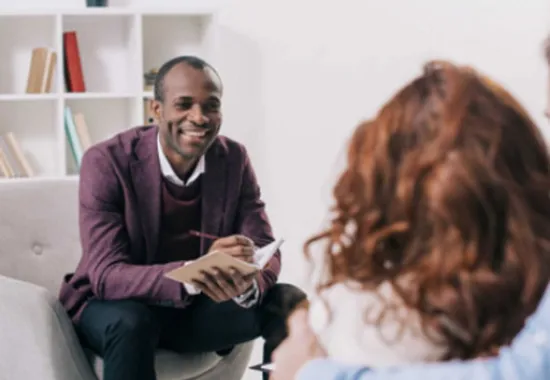 Counselor working with client