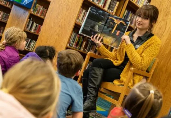 Librarian reading to students.