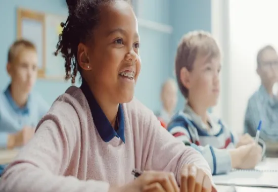 Students smiling while learning.
