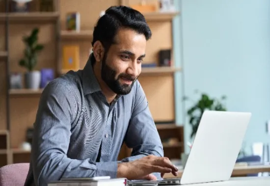 Man working on a laptop computer.