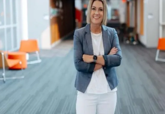 Woman standing with her arms crossed.