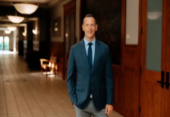Man standing looking at the camera.