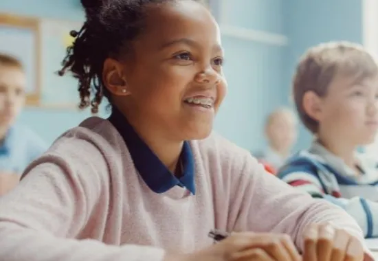Students smiling while learning.