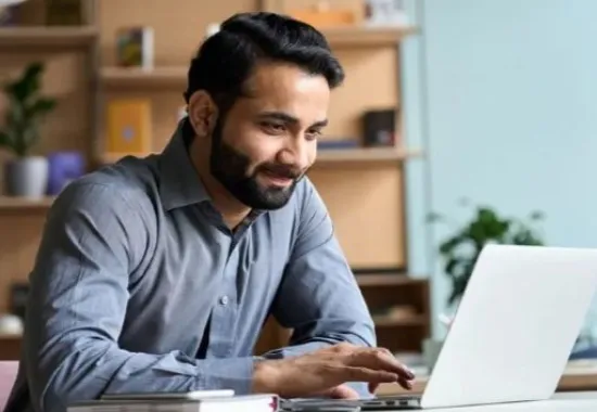 Man working on a laptop computer.