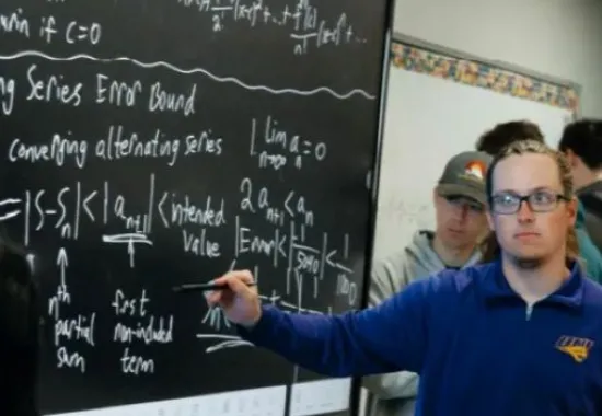Student teaching a business problem.