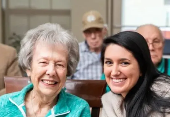 Student with an elderly woman.